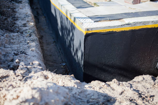 Professional Basement Waterproofing technician working in Deer Park, NY